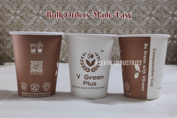 VELVIN INDUSTRIES – V GREEN Plus compostable paper cups in brown and white designs, displayed on a clean surface